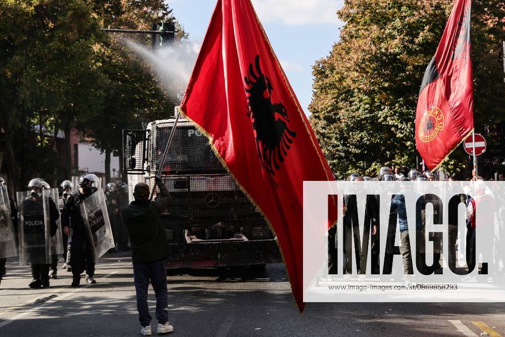 TIRANA, ALBANIA, OCTOBER 18, 2026: Demonstrators clash with riot police outside the Ministry of Education in Tirana as student-led anti-government protests continue for a sixth consecutive day. Protesters throw stones while police respond with tear gas, water cannons and rubber bullets. The demonstrations demand improved university conditions and the resignation of Prime Minister Edi Rama. Tirana Albania - ZUMAq101 20261018_zna_q101_067