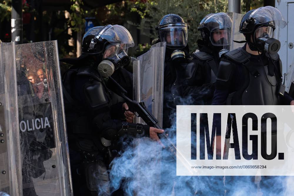 TIRANA, ALBANIA, OCTOBER 18, 2026: Demonstrators clash with riot police outside the Ministry of Education in Tirana as student-led anti-government protests continue for a sixth consecutive day. Protesters throw stones while police respond with tear gas, water cannons and rubber bullets. The demonstrations demand improved university conditions and the resignation of Prime Minister Edi Rama. Tirana Albania - ZUMAq101 20261018_zna_q101_068