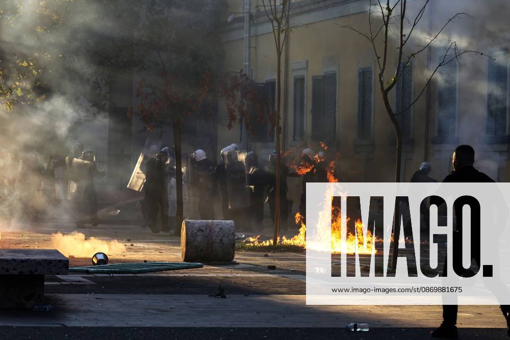 TIRANA, ALBANIA, OCTOBER 18, 2026: Demonstrators clash with riot police in Skanderbeg Square as student-led anti-government protests continue for a sixth consecutive day. Confrontations spread from the Ministry of Education to central Tirana, with protesters throwing stones and pyrotechnics while police deploy tear gas and water cannons. Demonstrators demand improved university conditions and the resignation of Prime Minister Edi Rama. Tirana Albania - ZUMAq101 20261018_zna_q101_217