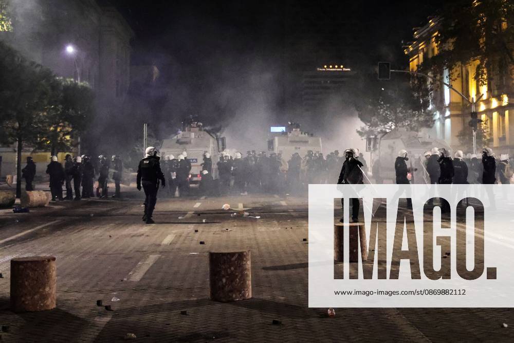 TIRANA, ALBANIA, OCTOBER 18, 2026: Demonstrators clash with riot police in Skanderbeg Square as student-led anti-government protests continue for a sixth consecutive day. Confrontations spread from the Ministry of Education to central Tirana, with protesters throwing stones and pyrotechnics while police deploy tear gas and water cannons. Demonstrators demand improved university conditions and the resignation of Prime Minister Edi Rama. Tirana Albania - ZUMAq101 20261018_zna_q101_227