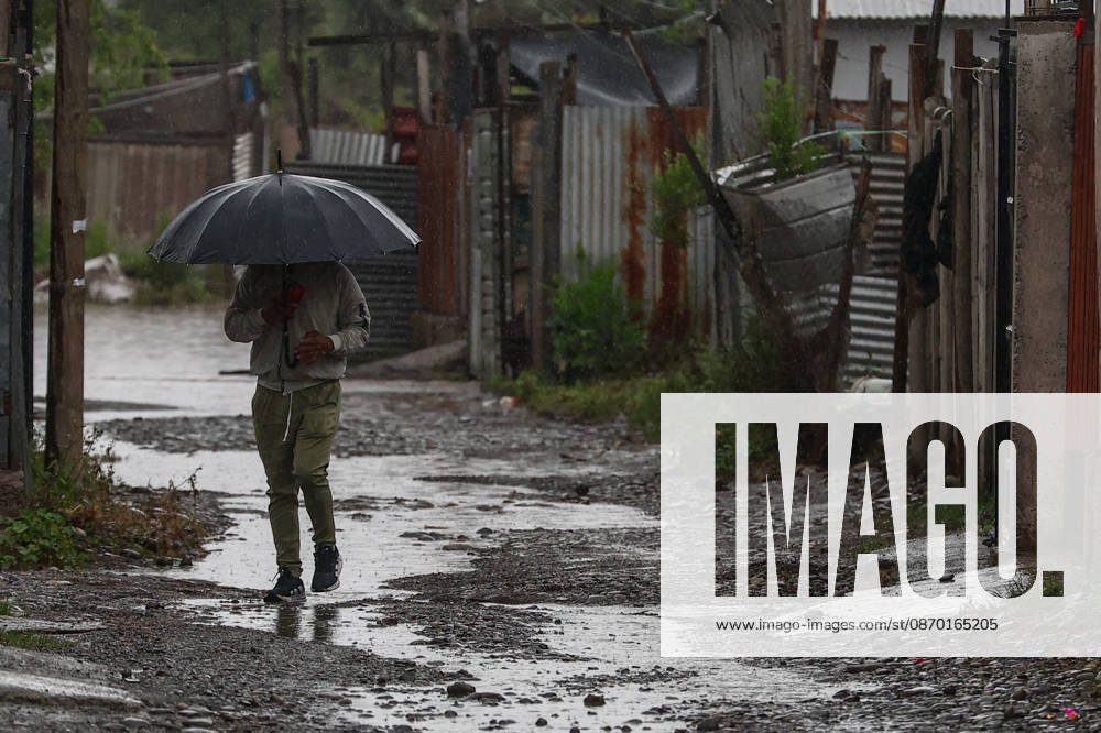 Heavy rainfall triggers red alert and emergency evacuations in Chile TALAGANTE, CHILE – OCTOBER 20: A person walks along a street with puddles in Talagante, on the outskirts of Santiago, Chile, on October 20, 2026. On Tuesday, Chile declared a red alert for the Metropolitan Region due to heavy rainfall, marking the rainiest October in Santiago in over a century. Lucas Aguayo Araos Anadolu Talagante Chile. Editorial use only. Please get in touch for any other usage.