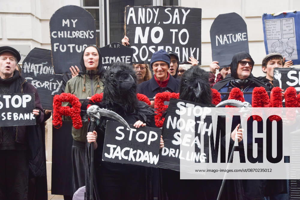 Activists from the climate action group Fossil Free London stage their second, death-themed protest of the day against the Jackdaw gas field and the Rosebank oil field in the North Sea outside the Department for Energy Security and Net Zero (DESNZ) as the government approves Jackdaw. London United Kingdom - ZUMAv130 20261021_zip_v130_040