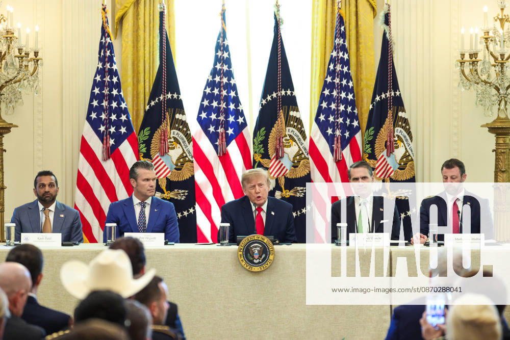 United States President Donald J Trump, center, speaks as, from left to right: Kash Patel, Director, Federal Bureau of Investigation (FBI), US Secretary of War Pete Hegseth, US Attorney General Todd Blanche and US Secretary of Homeland Security (DHS) Markwayne Mullin, listen during a roundtable discussion on cybercrime in the East Room of the White House on October 21, 2026 in Washington, D.C. The administration is fighting back against foreign-based organized criminal organizations that exploit Americans in cyberspace and their scam centers and fraud schemes Washington USA - ZUMAs152 20261021_faa_s152_050