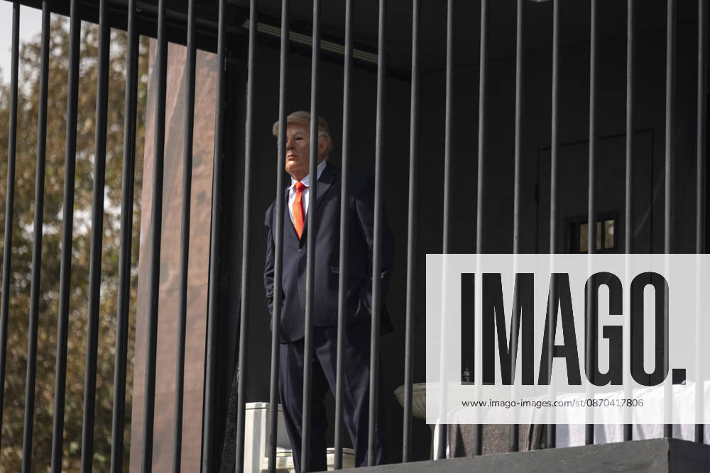 Anti-U.S. President Trump Performance On Billboard Reactions An Iranian masked man performs as U.S. President Donald Trump inside a symbolic cell mounted on a billboard in northern Tehran, Iran, on October 22, 2026, amid escalating tensions between Iran and the United States. Tehran Tehran Iran