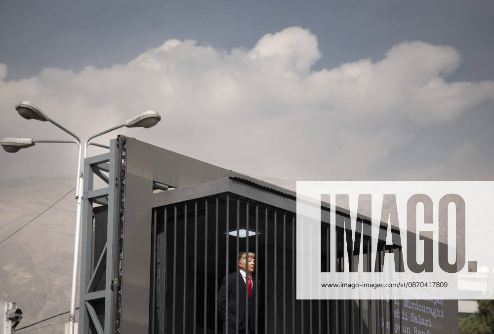 Anti-U.S. President Trump Performance On Billboard Reactions An Iranian masked man performs as U.S. President Donald Trump inside a symbolic cell mounted on a billboard in northern Tehran, Iran, on October 22, 2026, amid escalating tensions between Iran and the United States. Tehran Tehran Iran
