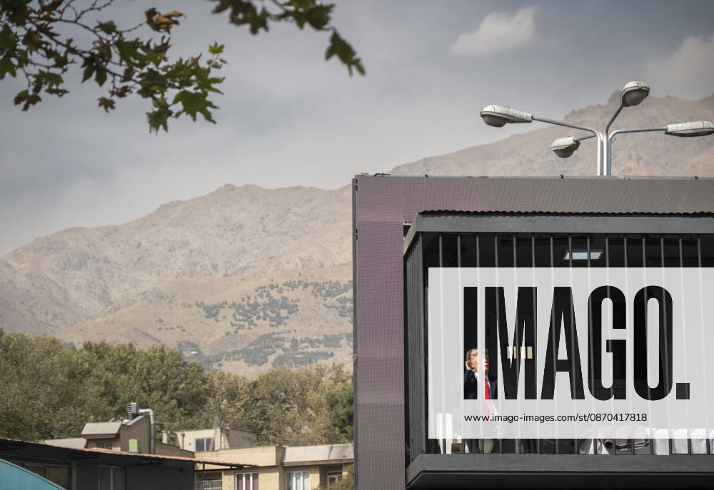 Anti-U.S. President Trump Performance On Billboard Reactions An Iranian masked man performs as U.S. President Donald Trump inside a symbolic cell mounted on a billboard in northern Tehran, Iran, on October 22, 2026, amid escalating tensions between Iran and the United States. Tehran Tehran Iran