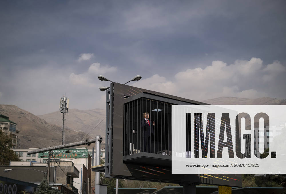 Anti-U.S. President Trump Performance On Billboard Reactions An Iranian masked man performs as U.S. President Donald Trump inside a symbolic cell mounted on a billboard in northern Tehran, Iran, on October 22, 2026, amid escalating tensions between Iran and the United States. Tehran Tehran Iran