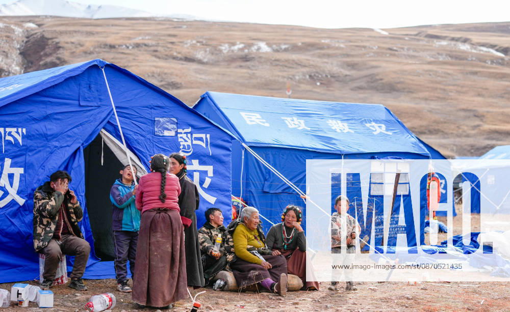 (261023) -- NAGQU, Oct. 23, 2026 -- People are seen at a temporary resettlement site of an earthquake-hit village in Maru Township of Baqen County, Nagqu City, southwest China s Xizang Autonomous Region, Oct. 23, 2026. China has allocated 50 million yuan (about 7.5 million U.S. dollars) in emergency disaster relief funds and earmarked another 30 million yuan for recovery efforts following a 7.0-magnitude earthquake in southwest China s Xizang Autonomous Region. The earthquake struck Baqen County of the city of Nagqu at 10:33 p.m. on Thursday, leaving 16 people dead and 54 injured. ) (SpotNews) CHINA-XIZANG-NAGQU-EARTHQUAKE-RESETTLEMENT (CN) TenzinxNyida