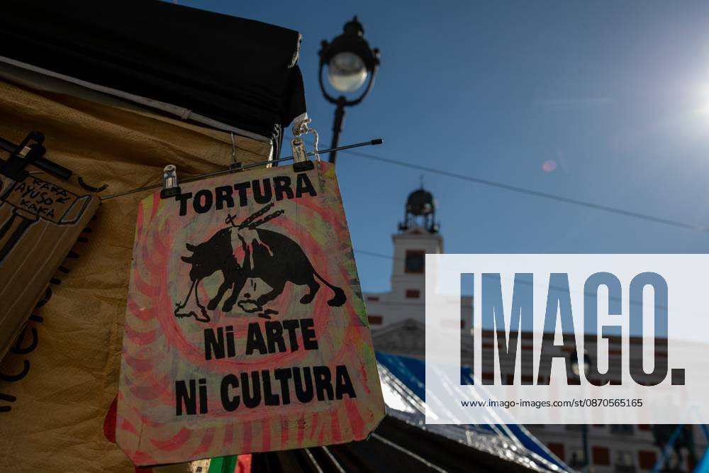 A banner featuring the phrase tortureÃ¢â‚¬neither art nor culture and an image of a bull can be seen at Puerta del Sol..Tents remain set up by housing rights activists, who organized the occupation of the square in response to the eviction of MaricarmenÃ¢â‚¬a woman in her eightiesÃ¢â‚¬from her home, carried out by a real estate investment fund. Madrid Spain - ZUMAs197 20261023_aaa_s197_155