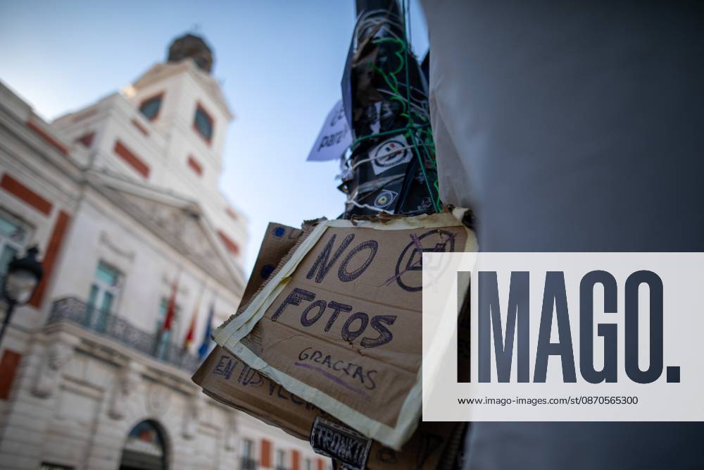 A sign prohibiting photography can be seen at Puerta del Sol..Tents remain set up by housing rights activists, who organized the occupation of the square in response to the eviction of MaricarmenÃ¢â‚¬a woman in her eightiesÃ¢â‚¬from her home, carried out by a real estate investment fund. Madrid Spain - ZUMAs197 20261023_aaa_s197_148
