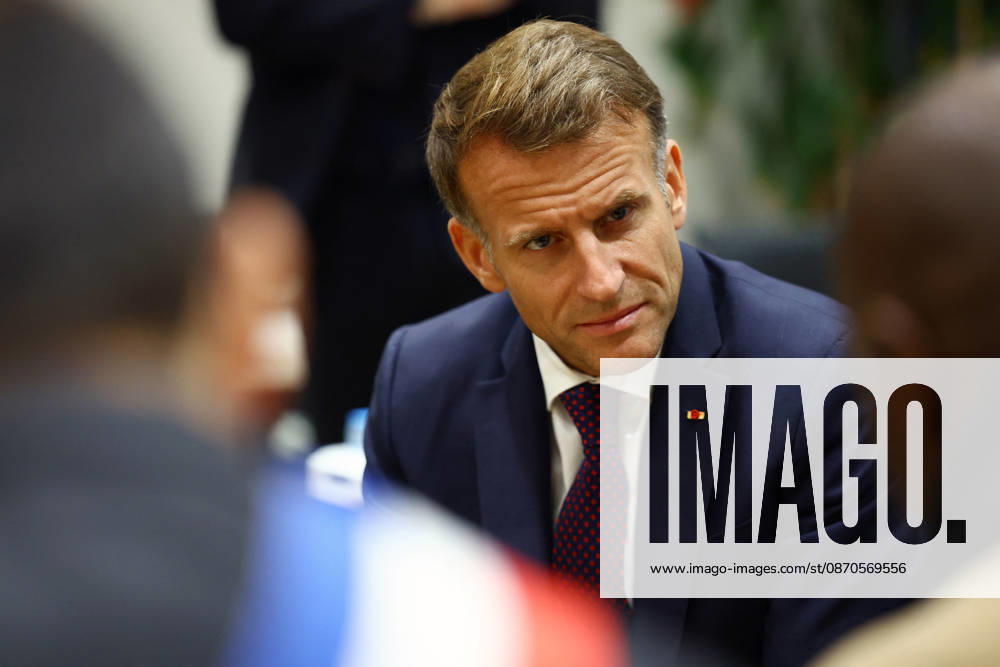 French President Macron in Trappes After Deadly Shooting - France French President Emmanuel Macron speaks with community members at the town hall after a drive-by shooting during which a person was killed and at least four others were wounded including a 12-year-old girl, in Trappes, in the Yvelines department, near Paris, France, October 23, 2026. Photo by Hannah McKay Pool ABACAPRESS.COM Trappes France