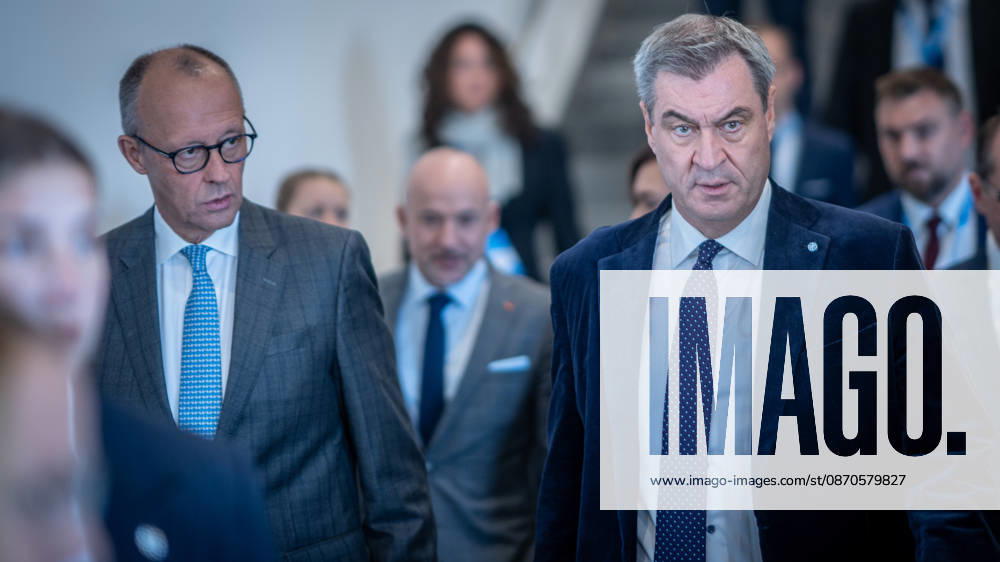 Chancellor Friedrich Merz speaks here alongside CSU Party Chairman Markus Söder on their way to Exhibition Hall C6 at the CSU Party Convention in Munich, Munich, Bavaria, Germany, Munich Exhibition Center