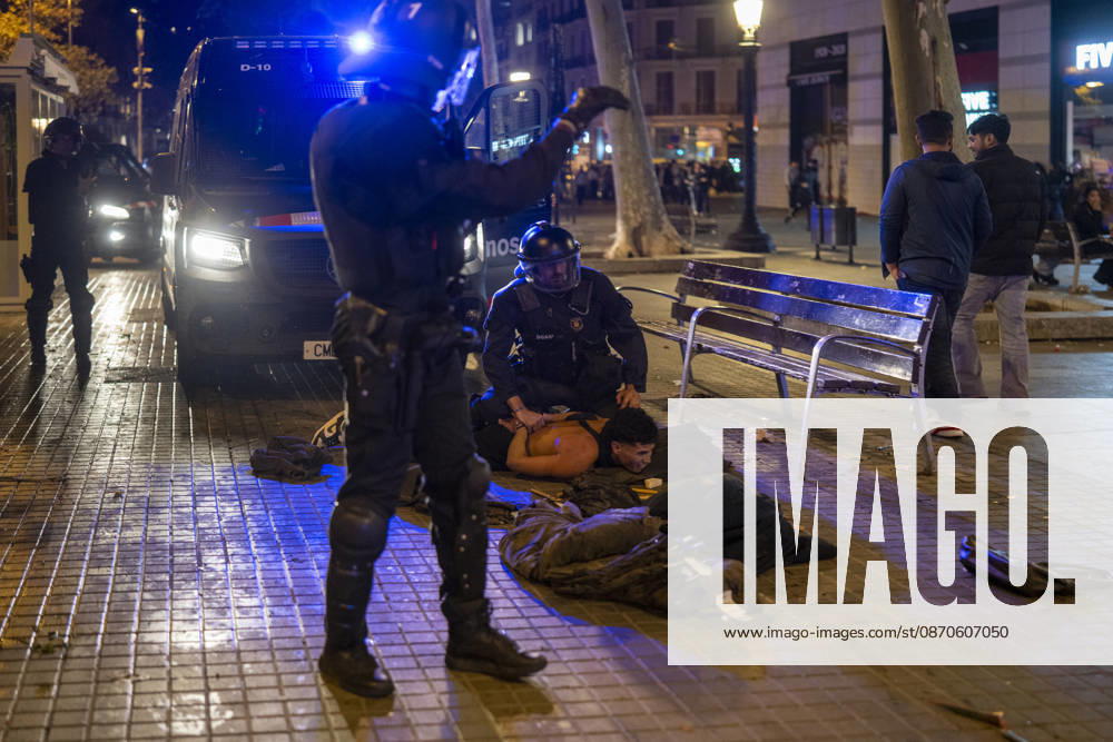 Police intervene during protest in Barcelona BARCELONA, SPAIN - OCTOBER 24: A youth protest organized through social media escalated into clashes with police, burning barricades and looting in central Barcelona, on October 24, 2026. Around 100 people, including 27 minors, were arrested after groups threw objects at police, set fire to rubbish containers and damaged shops around Placa de Catalunya, La Rambla and Ronda Universitat. Catalan President Salvador Illa condemned the violence and said those responsible would face consequences. Lorena Sopena Lopez Anadolu Barcelona Spain. Editorial use only. Please get in touch for any other usage.