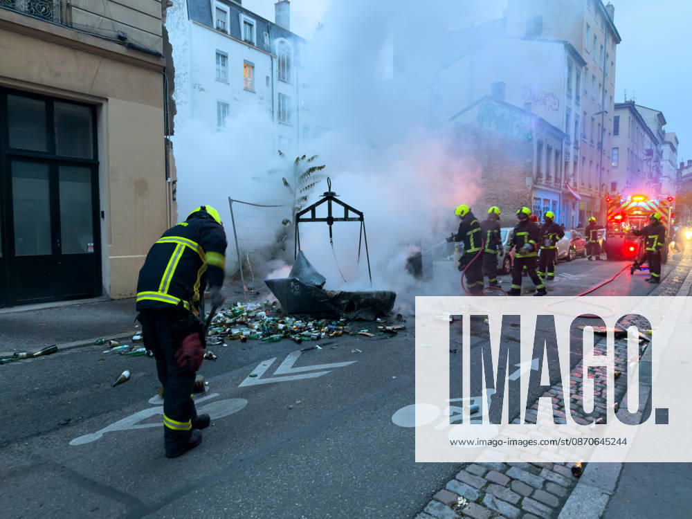 Lyon France Protests October 24 Firefighters extinguish a fire during a protest in Lyon, France on October 24, 2026. Authorities deployed around 70,000 security personnel across France for renewed protests over the cost of living, after unrest a week earlier saw public buildings damaged, hundreds of shops looted and about 2,700 people arrested. Lyon Rhone Alpes France