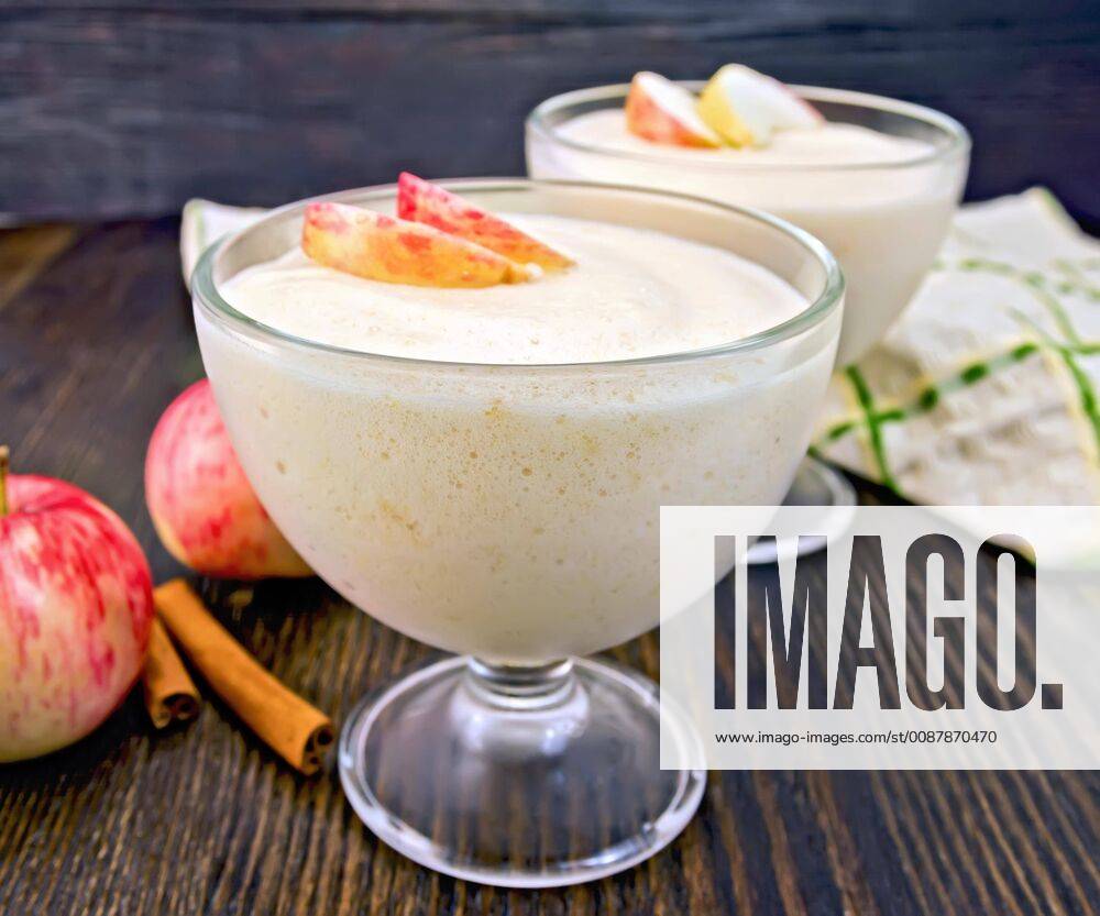 Jelly airy apple in glass bowl with cinnamon on board