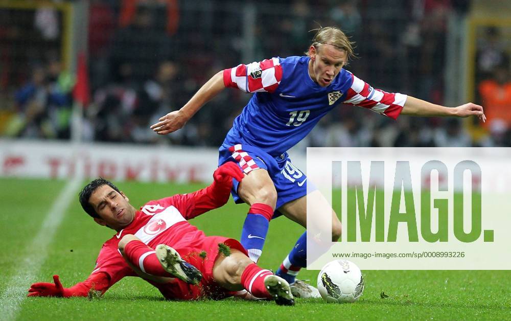 UEFA Euro 2012 play off first leg match between Turkey and Croatia ( blue)at Turk Telekom Arena Stadium in Istanbul, Turkey 11.11.2011 Match scored: Turkey 0 - Croatia 3 Pictured: Arda Turan of Turkey and Domagoj Vida of Croatia.