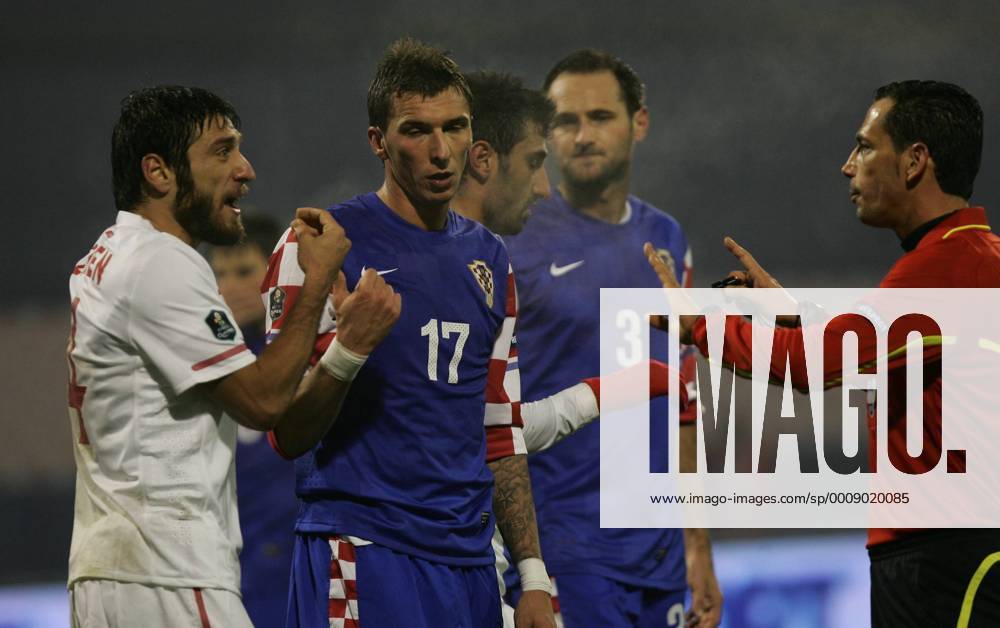 Zagreb, Croatia (blue) - Turkey (white), Mario Mandzukic (Croatia-17), Egemen Korkmaz (Turkey-4) and referee Pedro Proenca