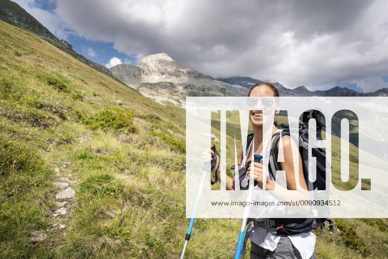 Switzerland, Valais, portrait of happy woman on a hiking trip in the mountains towards Foggenhorn model released Symbolfoto DMOF00131