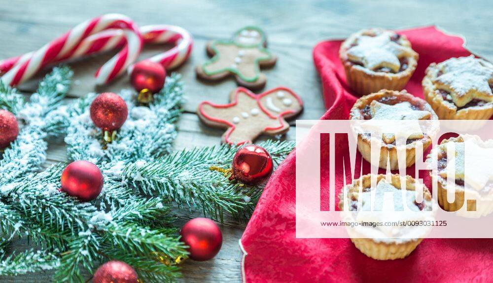 Decorated Christmas tree branch with holiday pastry