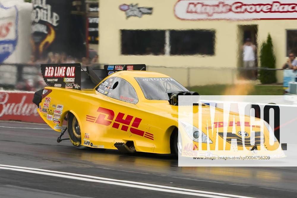 Jeff Arend, in the 170 DHL Funny Car, on a qualifying run during the ...