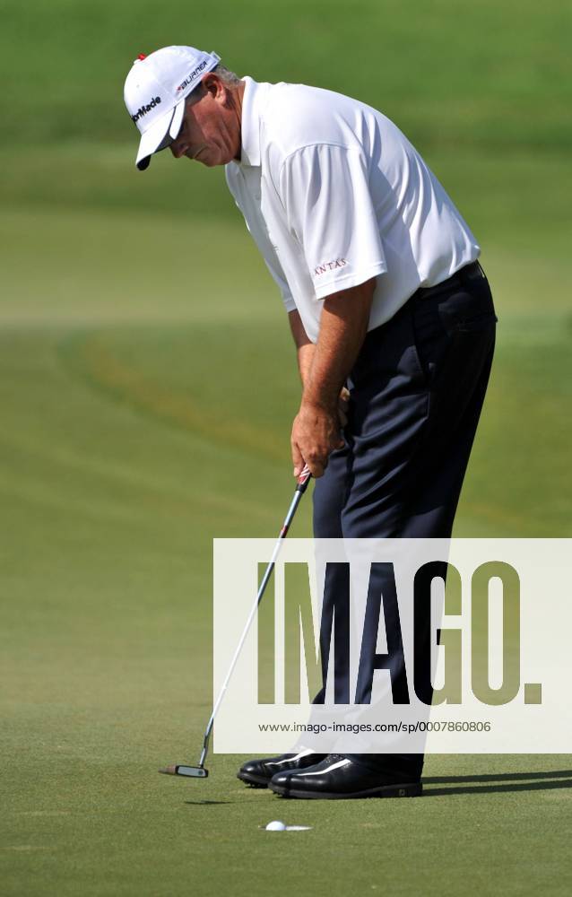 Paul Goydos (USA) watches his golf ball disappear into the cup for a ...