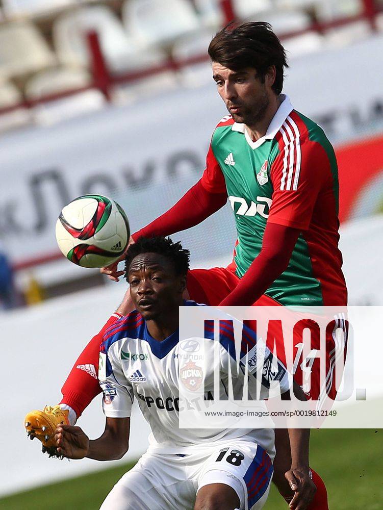 MOSCOW, RUSSIA. MAY 10, 2015. CSKA s Ahmed Musa (front) and Lokomotiv s ...