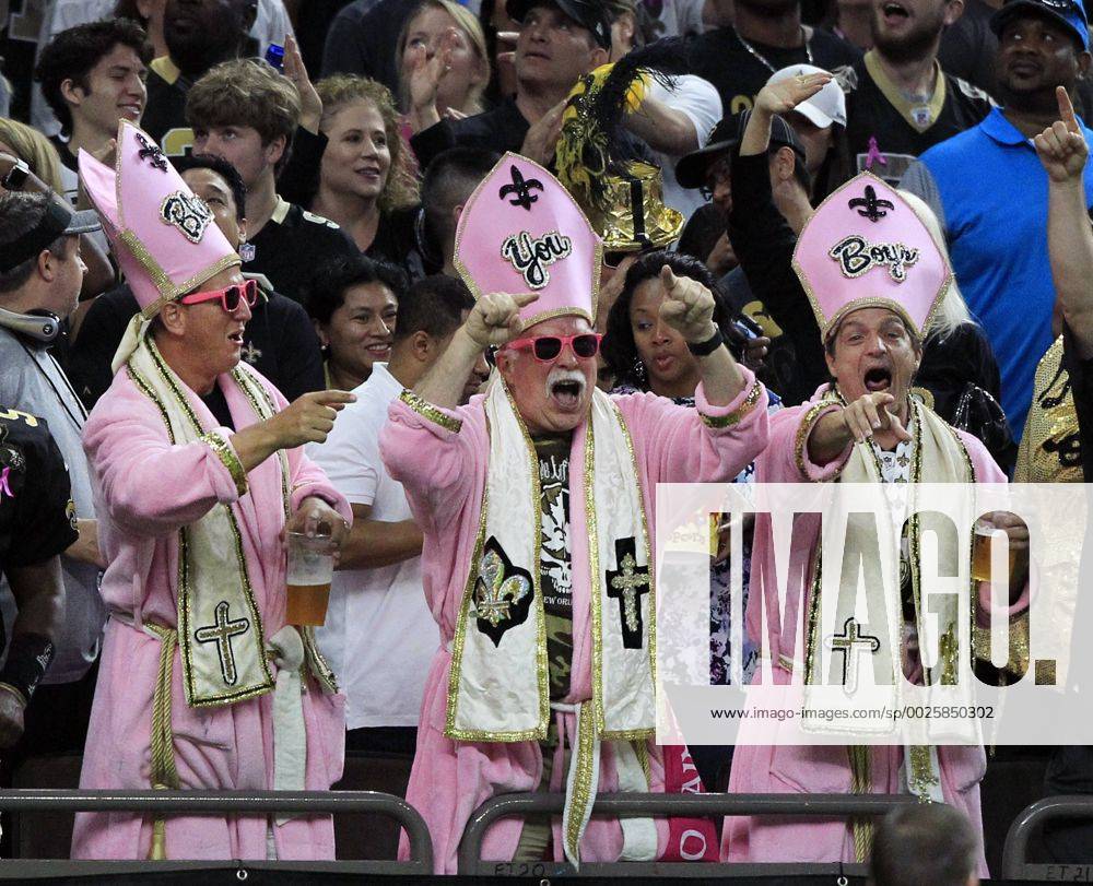 New Orleans Saints fans dressed as pink Popes to recognize Breast