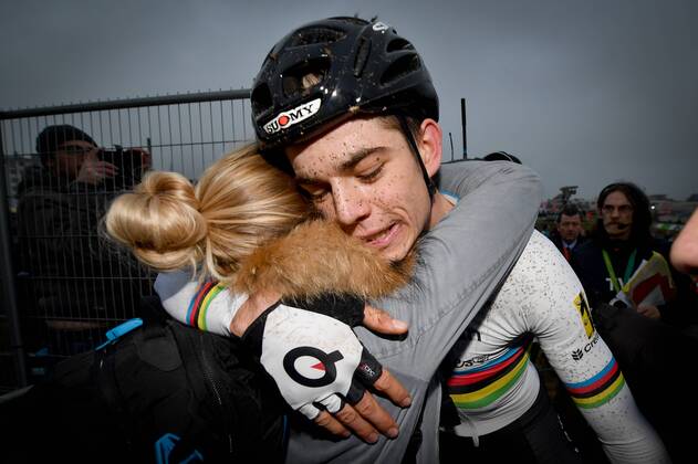 Belgian world champion Wout Van Aert and his girlfriend Sarah De Bie  celebrate after the elites