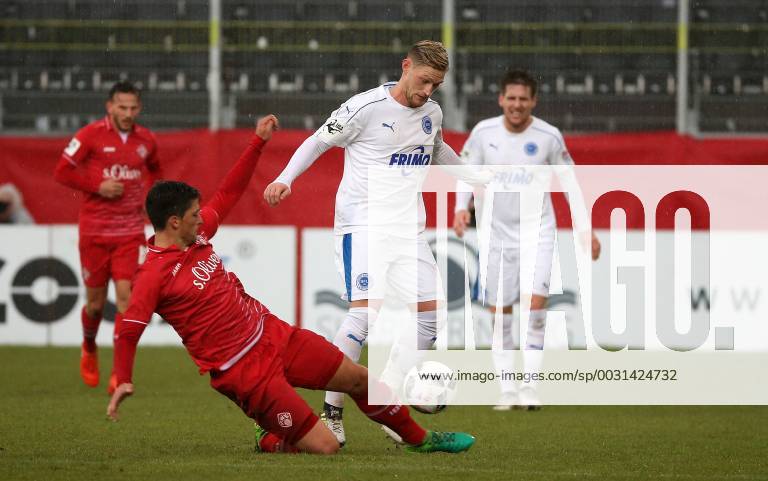 v left Jannis Nikolaou FC Würzburger Kickers in duel Duel tackle with ...