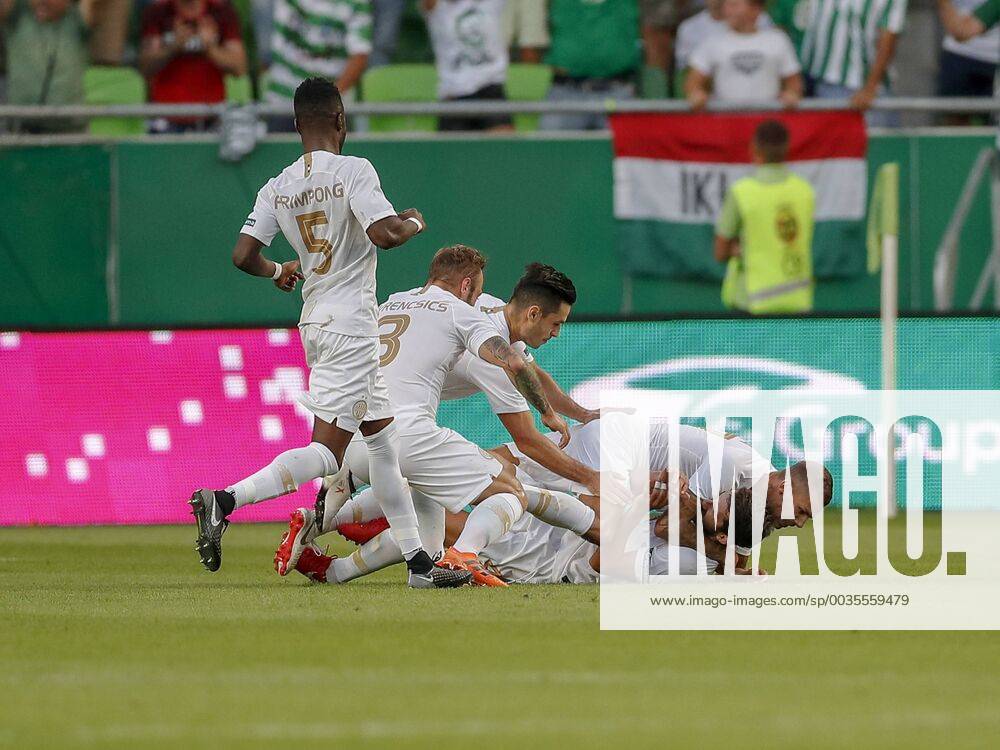 BUDAPEST, HUNGARY - JULY 12: (r-l) Roland Varga of Ferencvarosi TC hugs  goal scorer Stefan