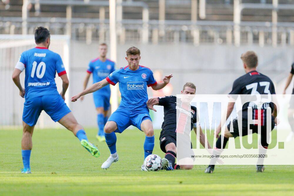 v left in a duel Daniel Grebe Wuppertal and Lars Bender Leverkusen left ...