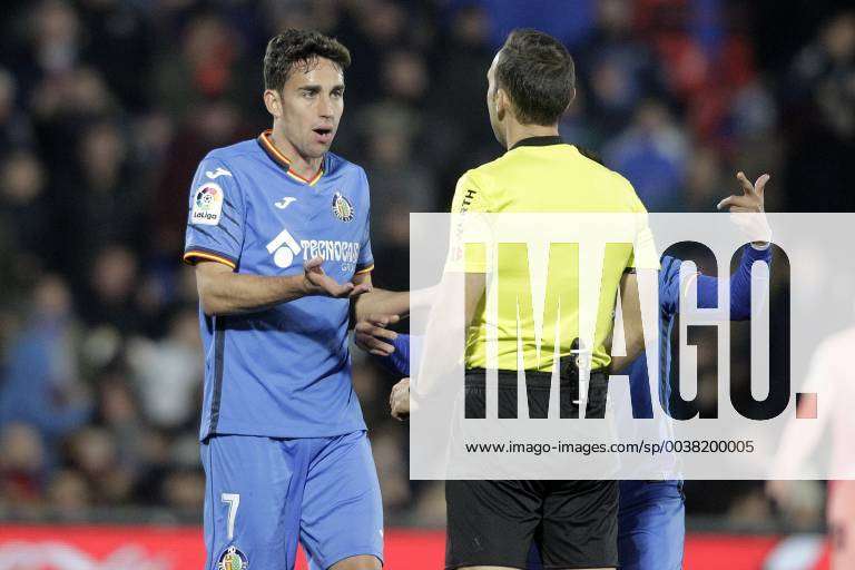 Getafe CF s Jaime Mata have words with the Spanish referee Juan Jose ...