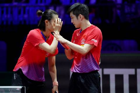 Fan Zhendong and Ding Ning of China react as they compete against Xu ...