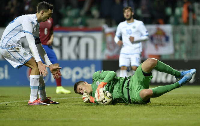 Michele Cevoli left and Mirco De Angelis of San Marino in action