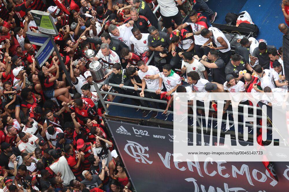 Flamengo s players celebrate with fans during a parade their team s