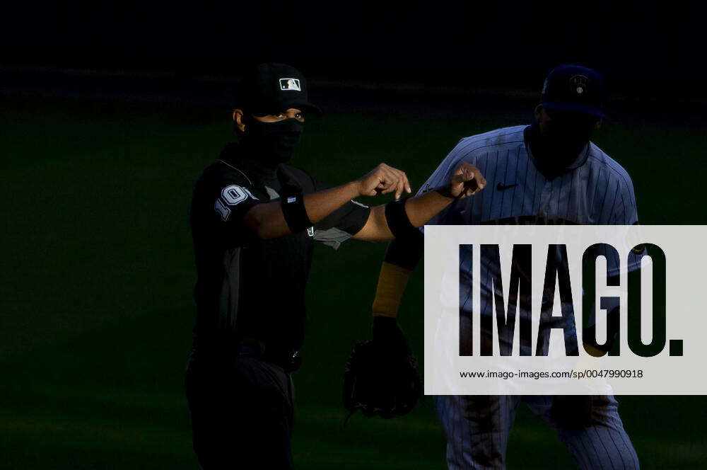 Major League umpire Erich Bacchus looks on during the game between