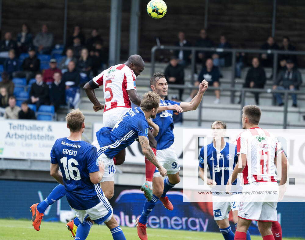 AaBs Jores Okore in a duel with Lyngbys Nicolai Geertsen and Lasse ...