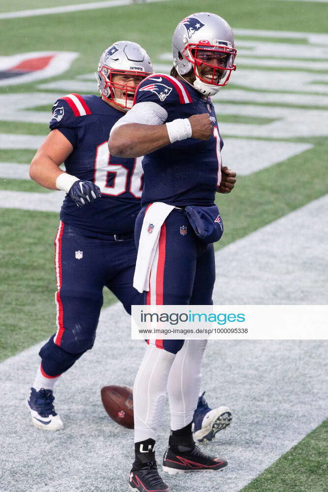 New England Patriots quarterback Cam Newton (1) celebrates with offensive  lineman James Ferentz (66)