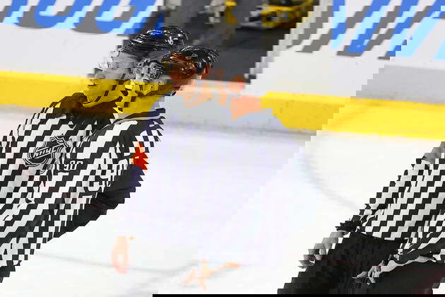 NEWARK, NJ - FEBRUARY 27: Referee TJ Luxmore 21 talks with linesman Travis  Toomey 90 during the