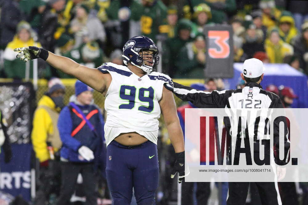 GREEN BAY, WI - NOVEMBER 14: Seattle Seahawks defensive tackle Al Woods (99)  mimics the call of