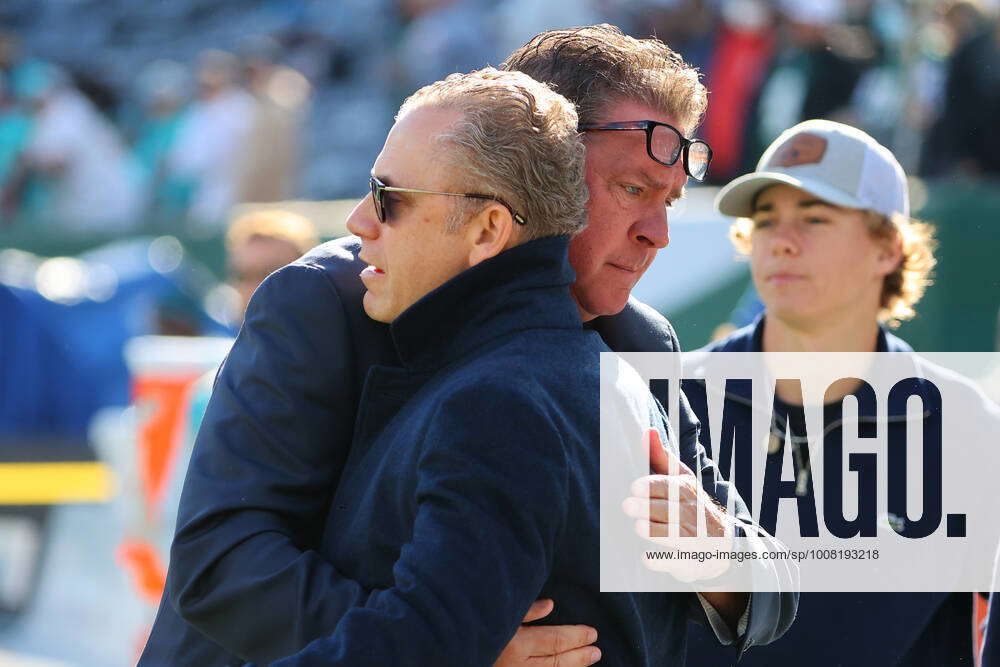 EAST RUTHERFORD, NJ - NOVEMBER 21: Miami Dolphins Vice Chairman Partner Bruce  Beal hugs NFL, America