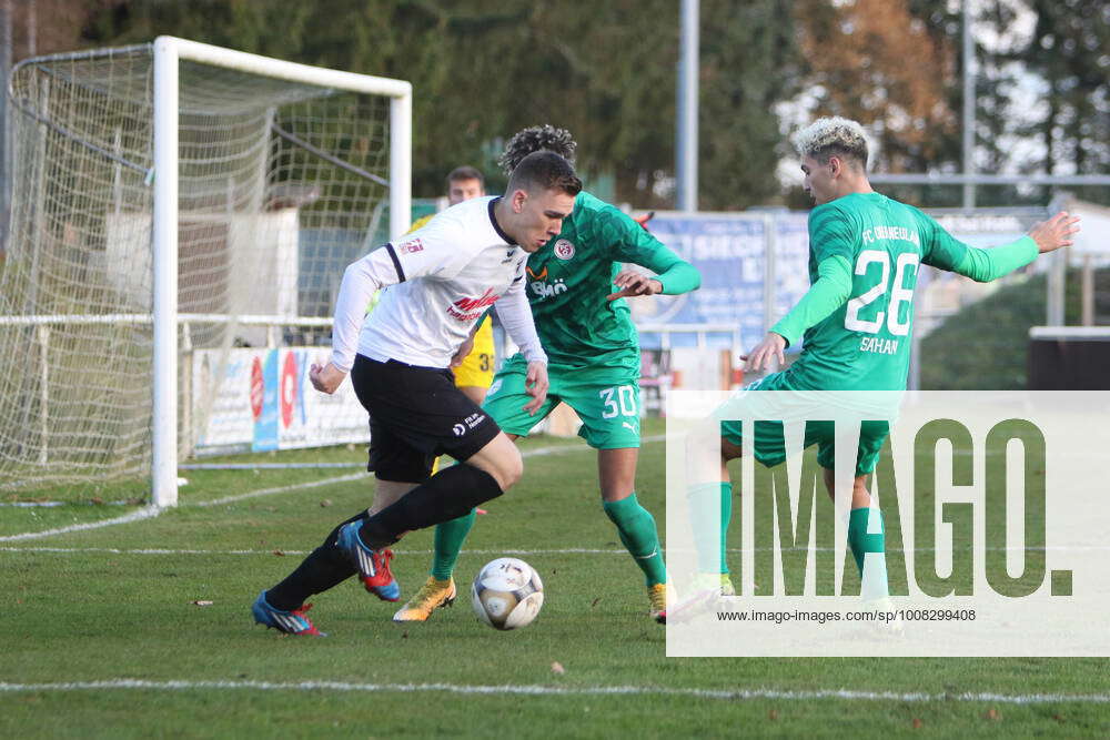 Malte Meyer LSK, in front claims the ball from Amiro Amadou undercover ...