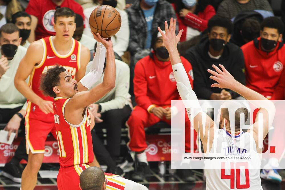 Trae Young 11 of the Atlanta Hawks shoots a jump shot as Ivica Zubac 40 ...