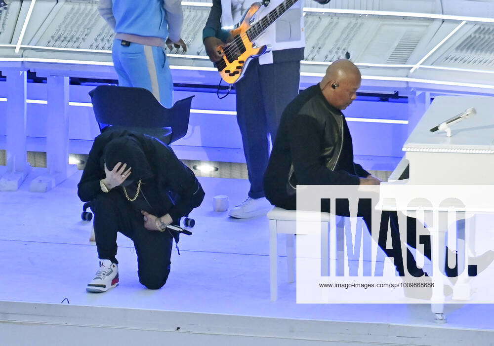 Eminem kneels after his performance during Super Bowl LVI halftime