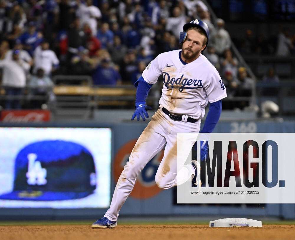 Los Angeles Dodgers second baseman Gavin Lux runs to third on a triple ...