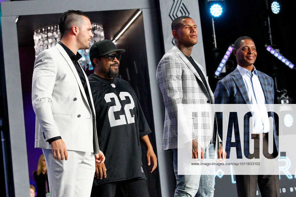 Rapper Ice Cube, right, hugs Las Vegas Raiders quarterback Derek Carr  during the first round of the NFL football draft Thursday, April 28, 2022,  in Las Vegas. (AP Photo/John Locher Stock Photo 