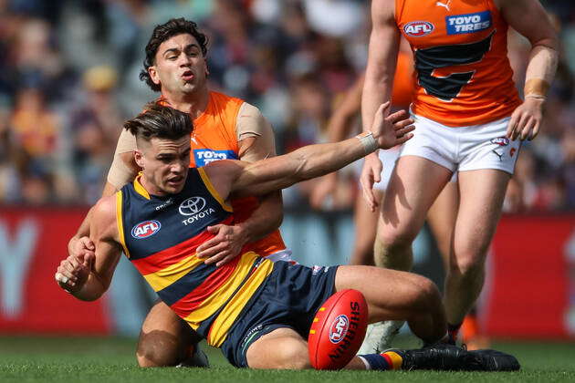 AFL CROWS GIANTS, Ben Keays of the Crows is tacked by Tim Taranto of ...