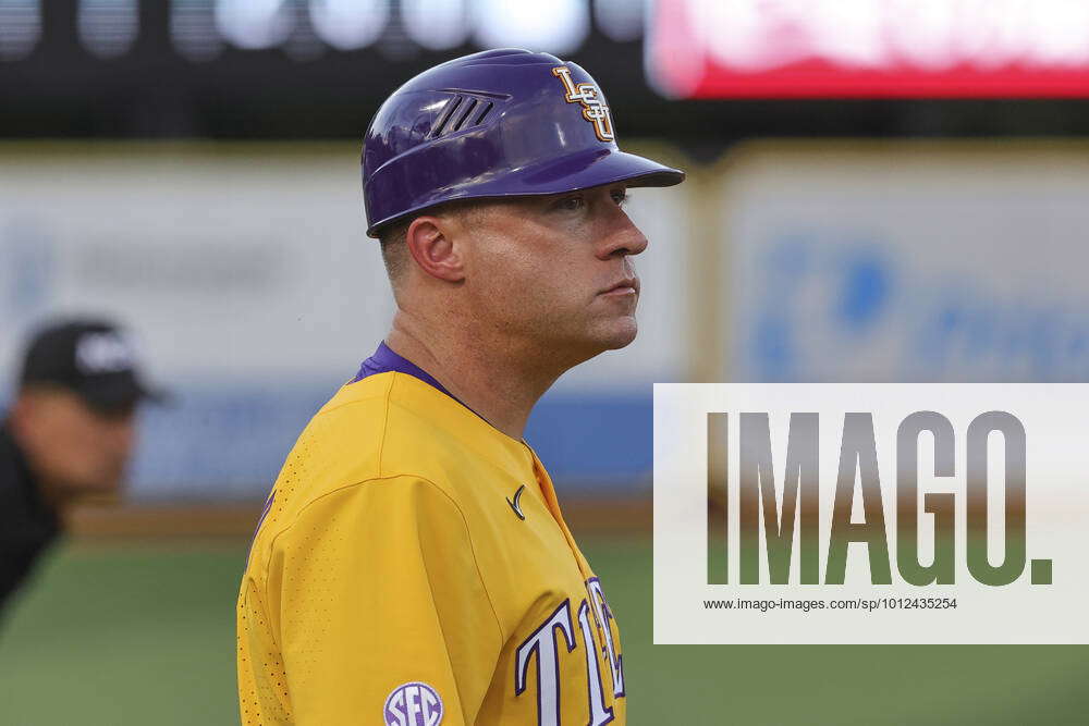Jun 3, 2022 LSU assistant coach Dan Fitzgerald (11) coaches at third