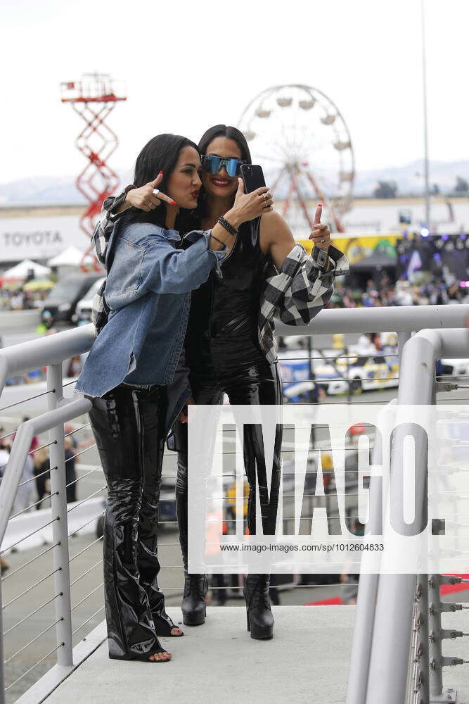 SONOMA, CA - JUNE 12: Professional tag team wrestlers The Bella Twins, Brie  Bella (left) and Nikki Bella (right) during a pre race press conference for  the NASCAR Cup Series Toyota/Save Mart