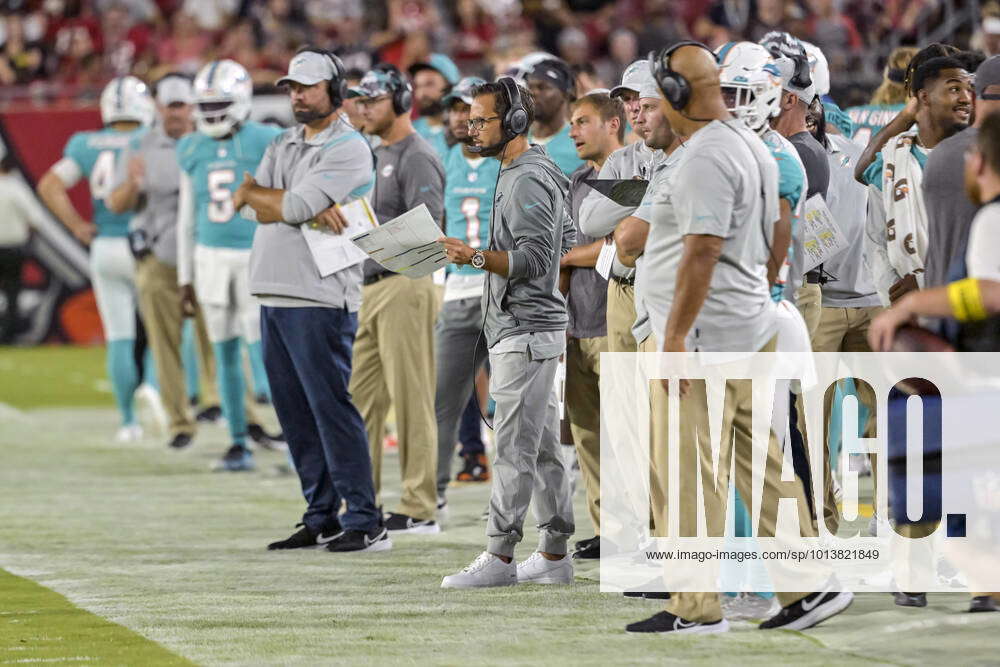 Miami Dolphins head coach Mike McDaniel (C) watches from the sidelines  during the first half of